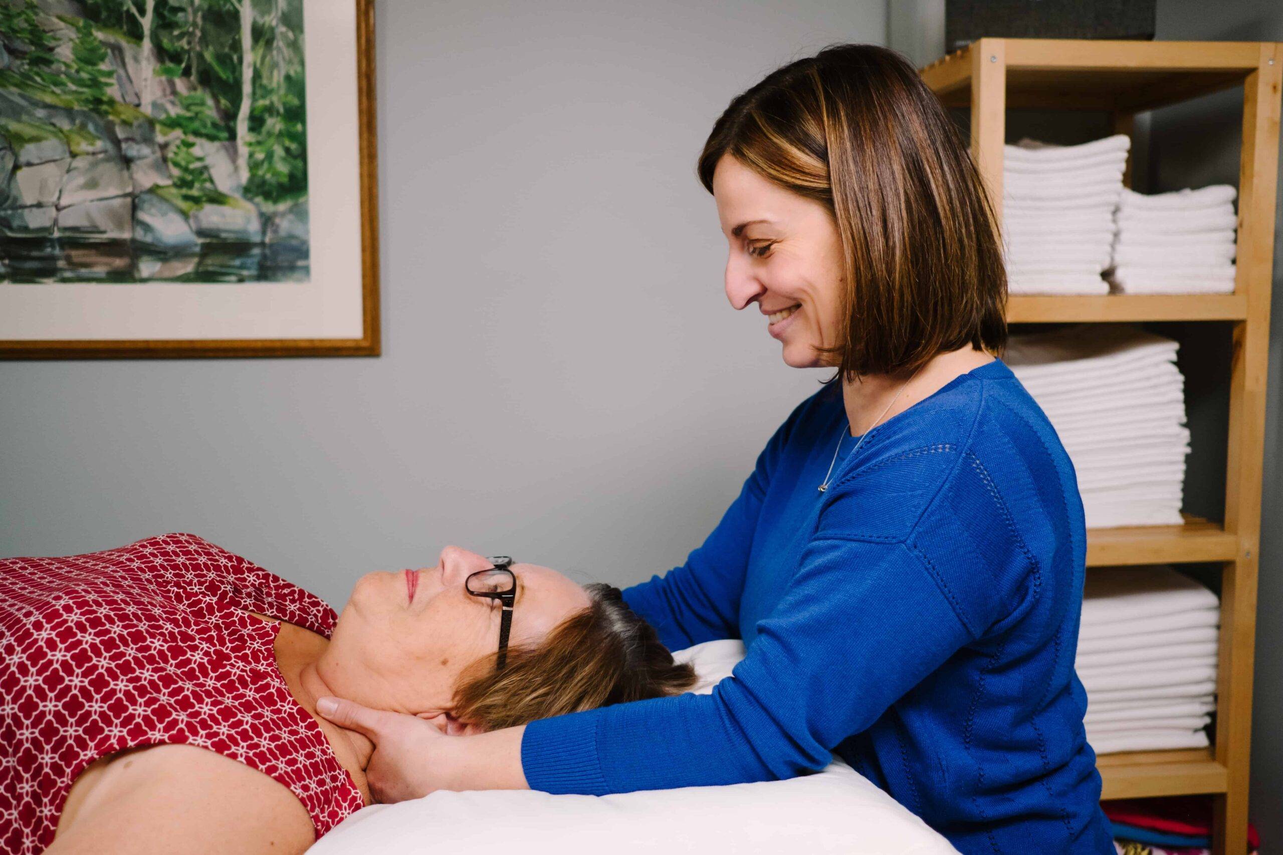 Physiotherapist Beth Hoag applies manual therapy to a patient to help alleviate the side-effects of cancer treatment.